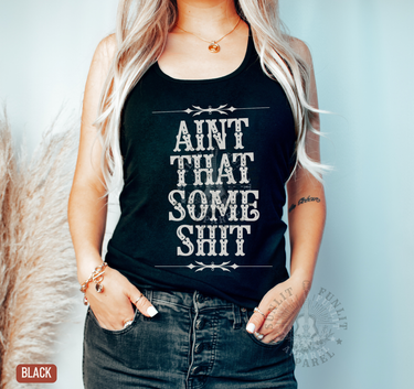 A woman wearing a black tank top with the text